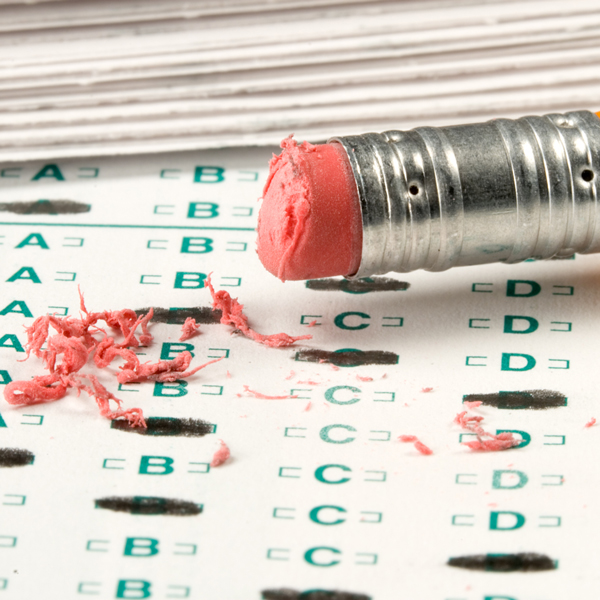 A filled-in scantron test with pencil eraser filings.