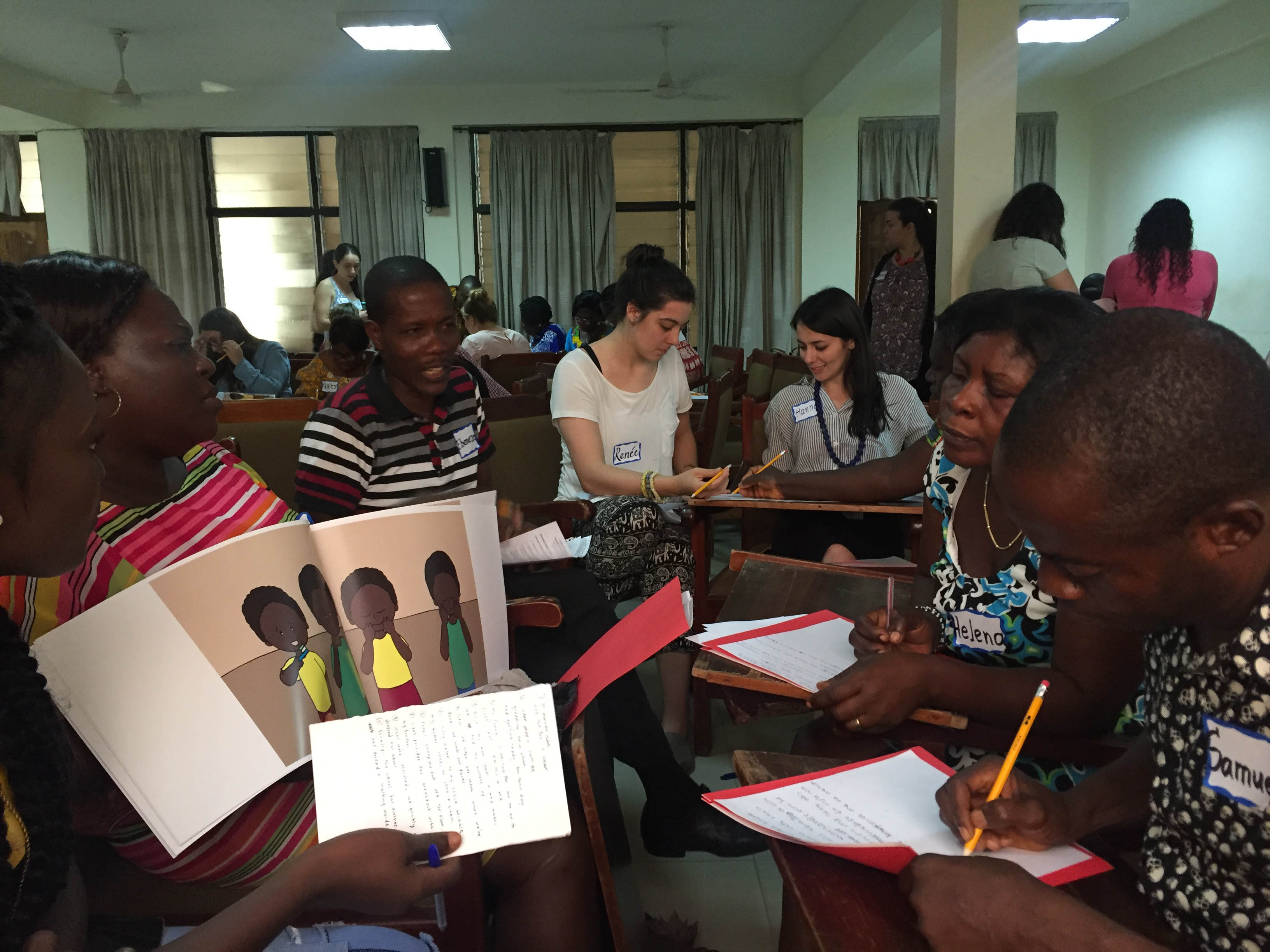 Unti school teachers and TC CSD students work to translate the All About My School book into Twi