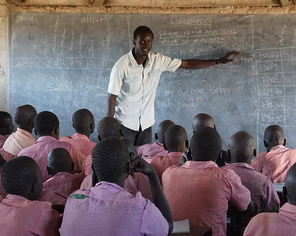 HEROIC EFFORTS Teachers at Kakuma refugee camp, most of whom are refugees themselves and lack formal training, face classrooms of more than 150 students. (Photo Credit: Danielle Falk) 
