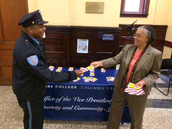 WE THE PEOPLE On Constitution Day at Teachers College, Janice Robinson, Vice President for Diversity & Community Affairs, handed out all seven genuine Articles in Zankel Hall lobby. Public Safety Officer Dennis Chambers (Ed.D.,'10; MA,'02; MA,'99) received his copy. 