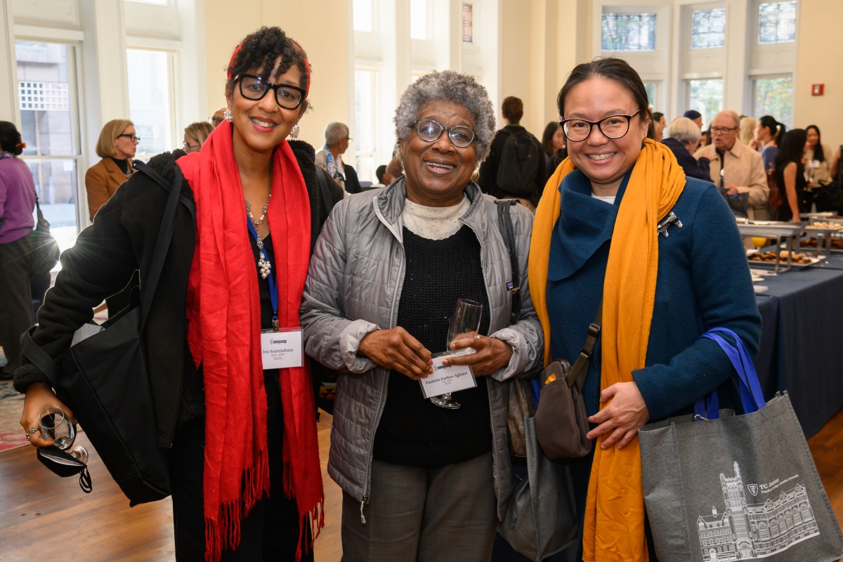 Guests smiling at Alumni Day