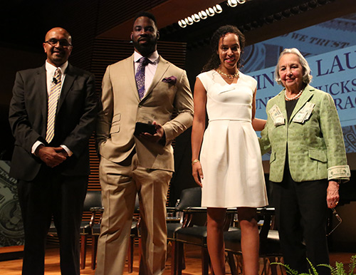 FINANCIAL FAB FOUR Joyce Cowin (M.A. '52; far right), TC Trustee and founder of The Cowin Financial Literacy Program, with (from left) Cowin Program Director Anand Marri, and former New York Giants football great Justin Tuck and his wife, Lauran, founders of Tuck's R.U.S.H. for Literacy. (Photo: Bruce Gilbert)
