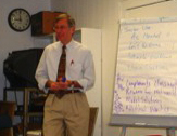 teacher near white board