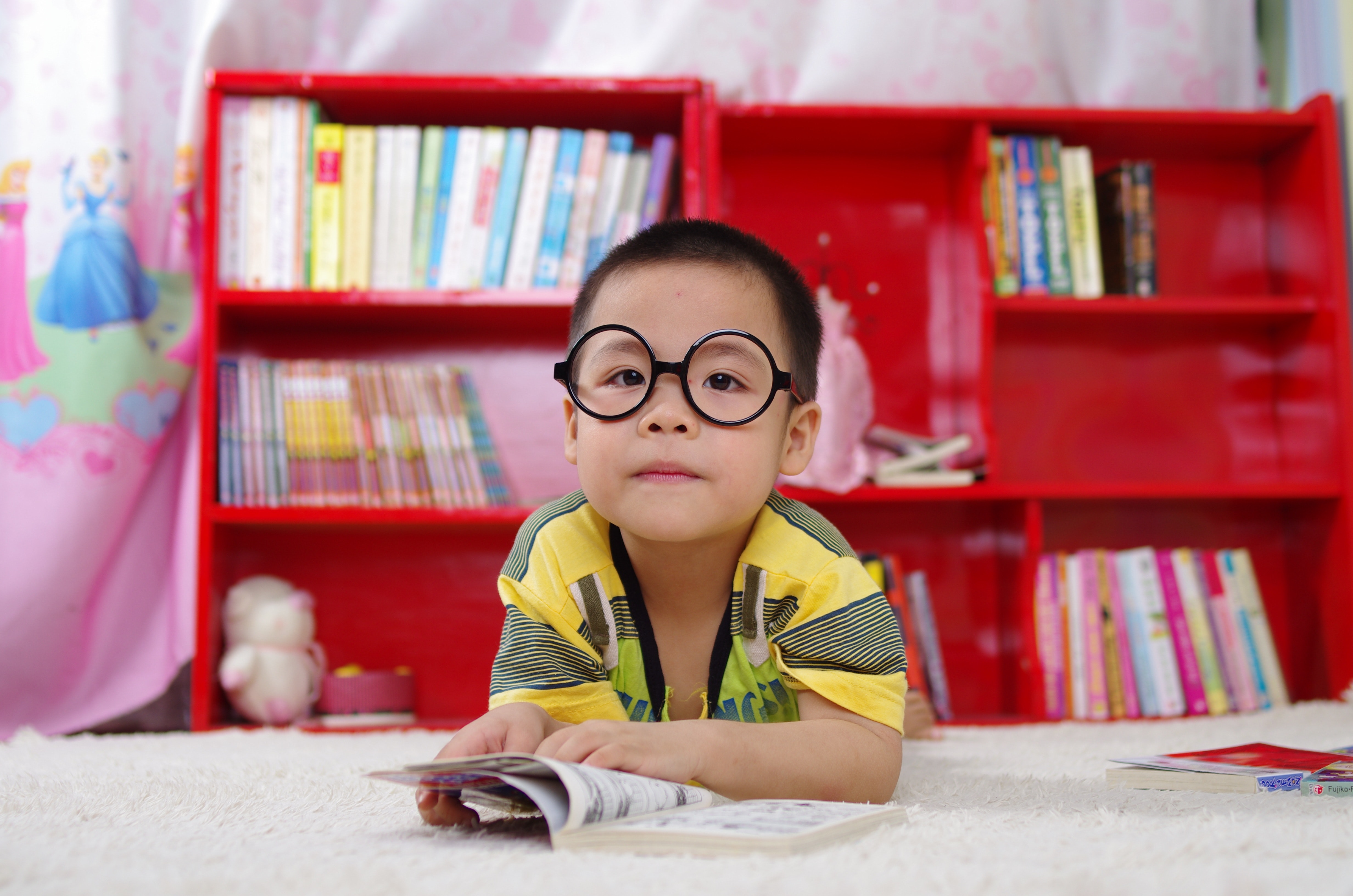 photo of kid in a library