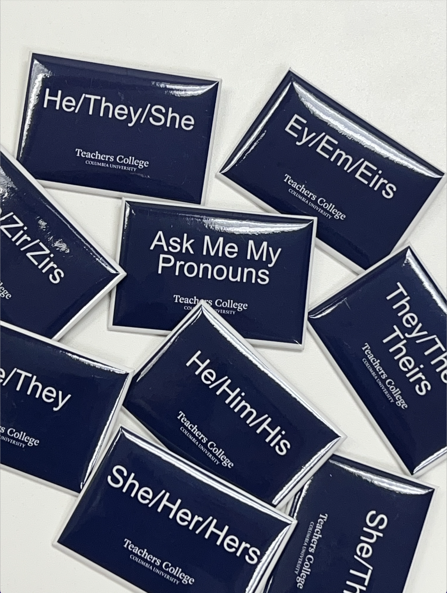 Image of various buttons correlating to students' pronouns (such as she/her/hers, they/them/theirs, ze/zir/zirs)