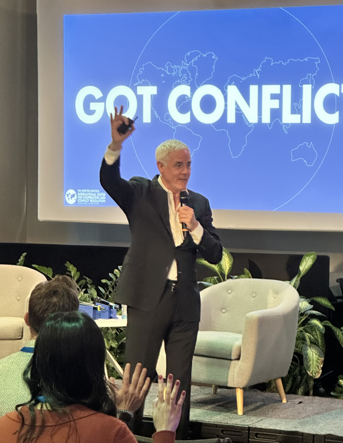 CIQ Launch Event - Peter Coleman speaking to audience with arm raised