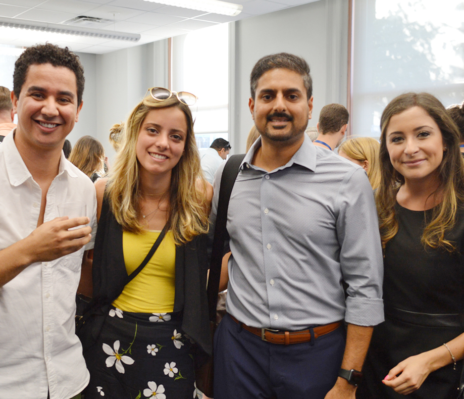 Four students smiling at the camera