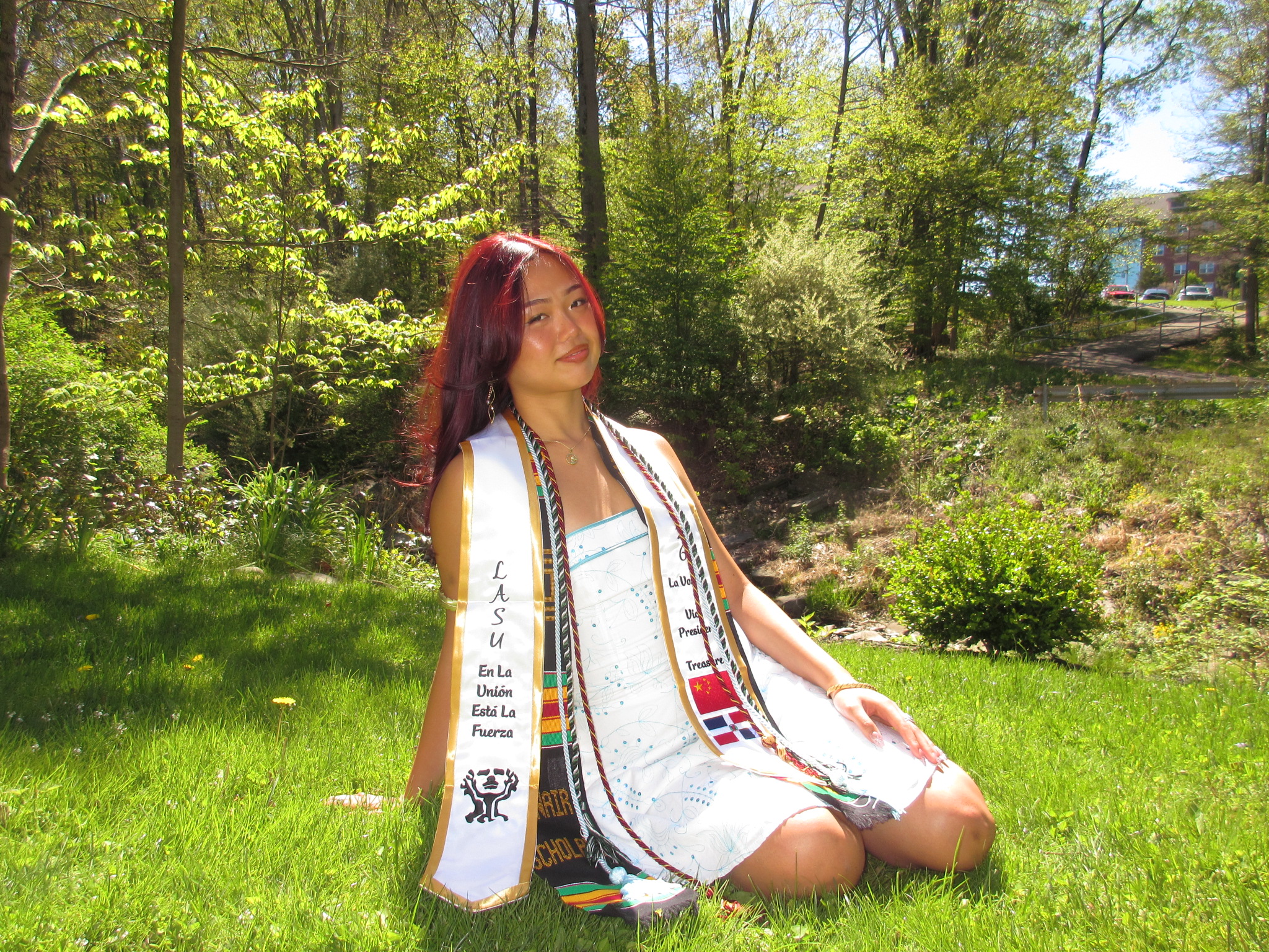 student sitting on grass