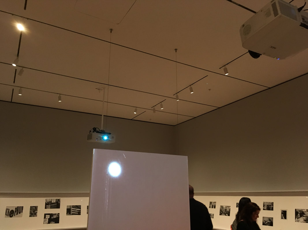Projection of circle of light against a white wall