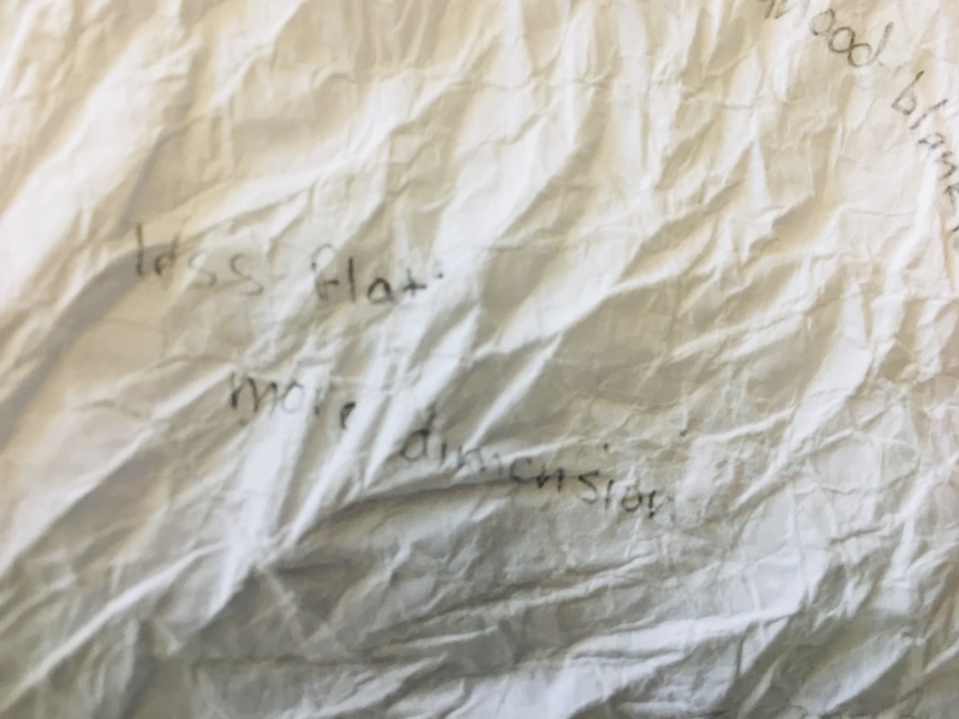 Crumpled paper with a sentence written on it