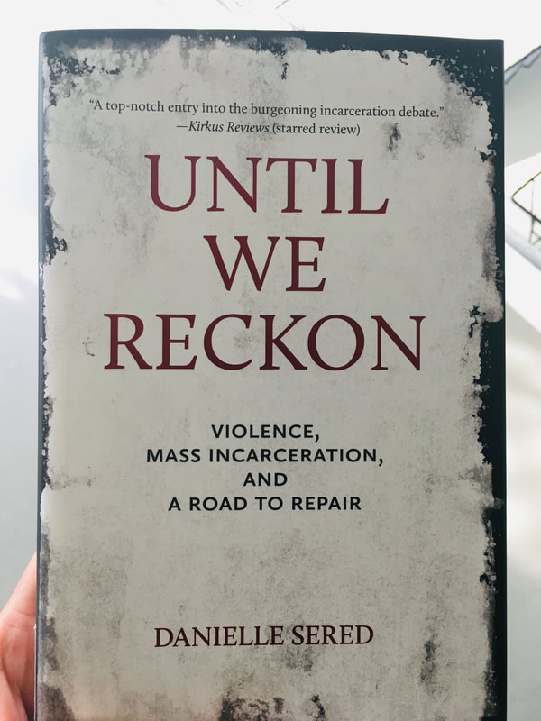 Book with title on large dark red letters Until We Reckon