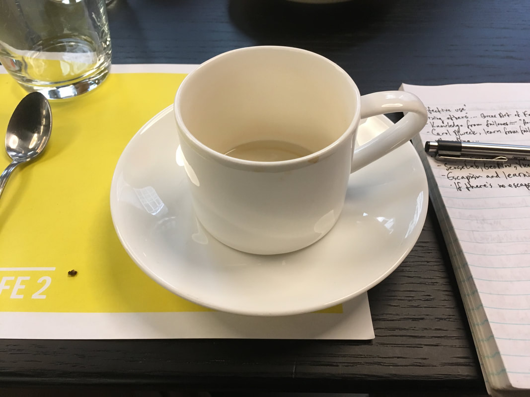 white coffee cup and coaster 