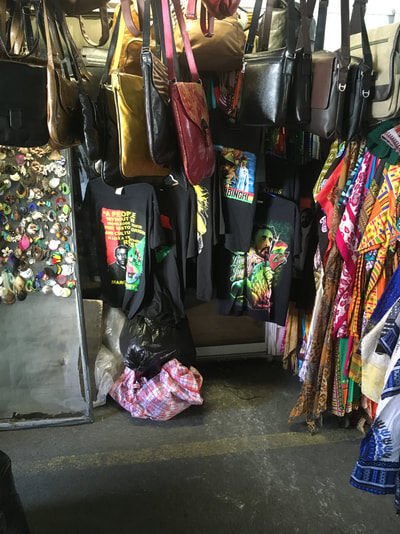 Bags and clothing inside a shop within the market