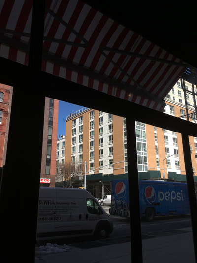 Red and white striped awning of market tent