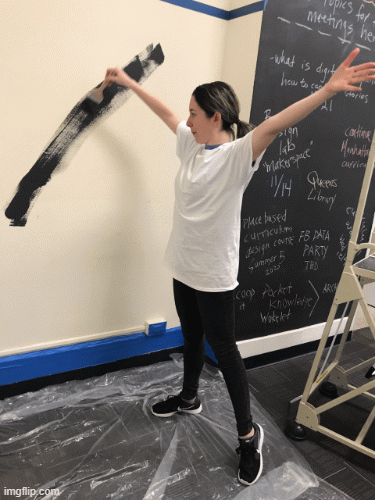Profile gif of Rachel Mewes standing up and stretching towards the sky