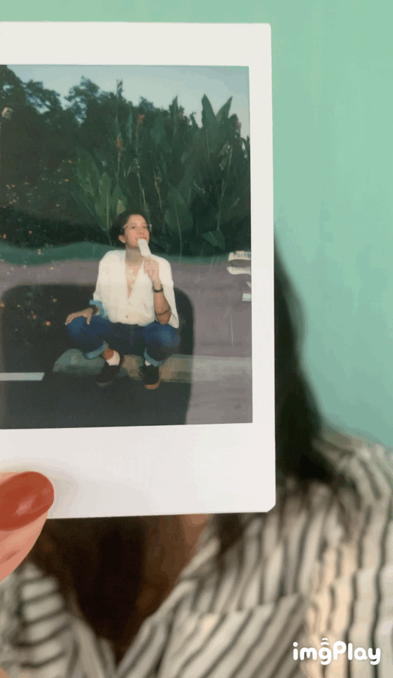 Profile gif of Raquel Vigil holding a polaroid