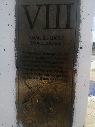 A bronzed plaque reads 