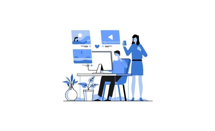Two people drawn in blue at a computer on white background