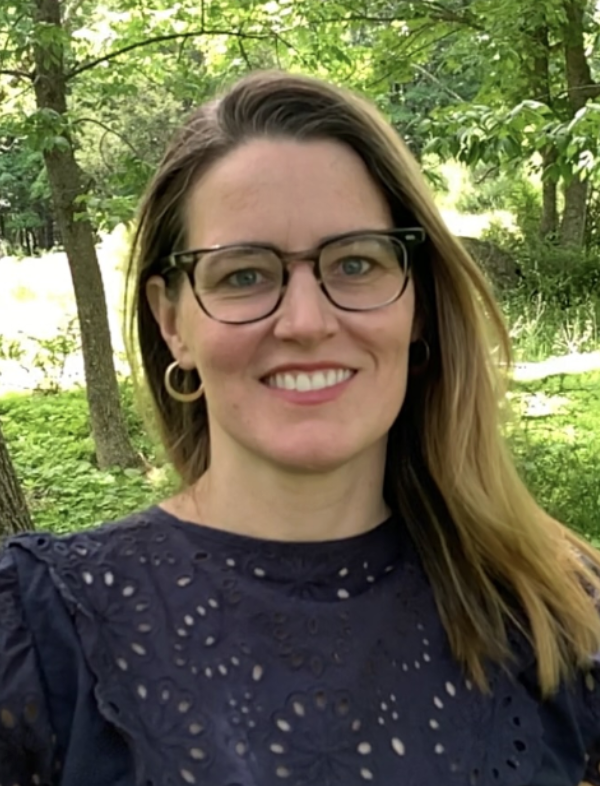 rachel smiling with trees in the background