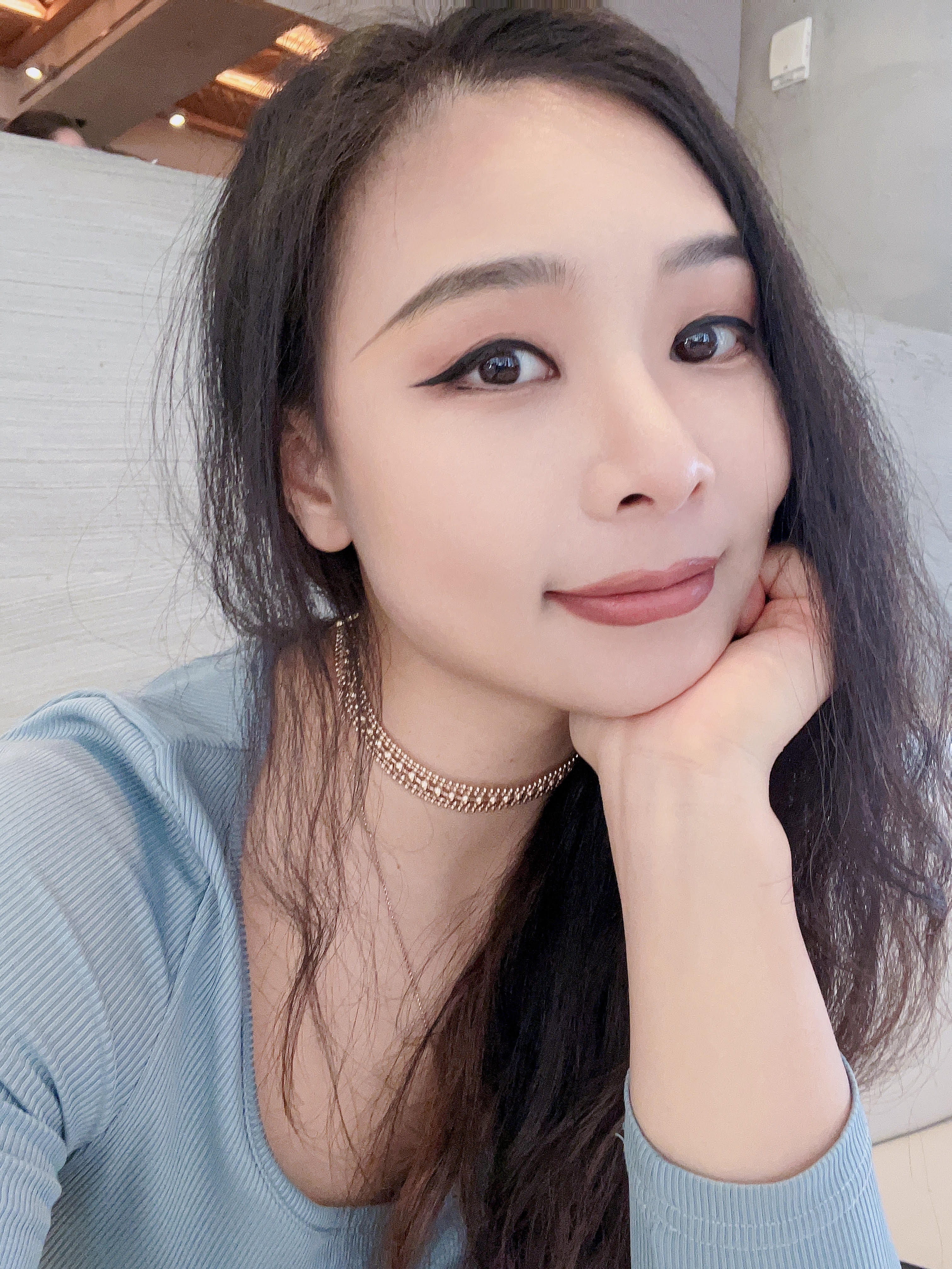 a young woman smiling at the camera