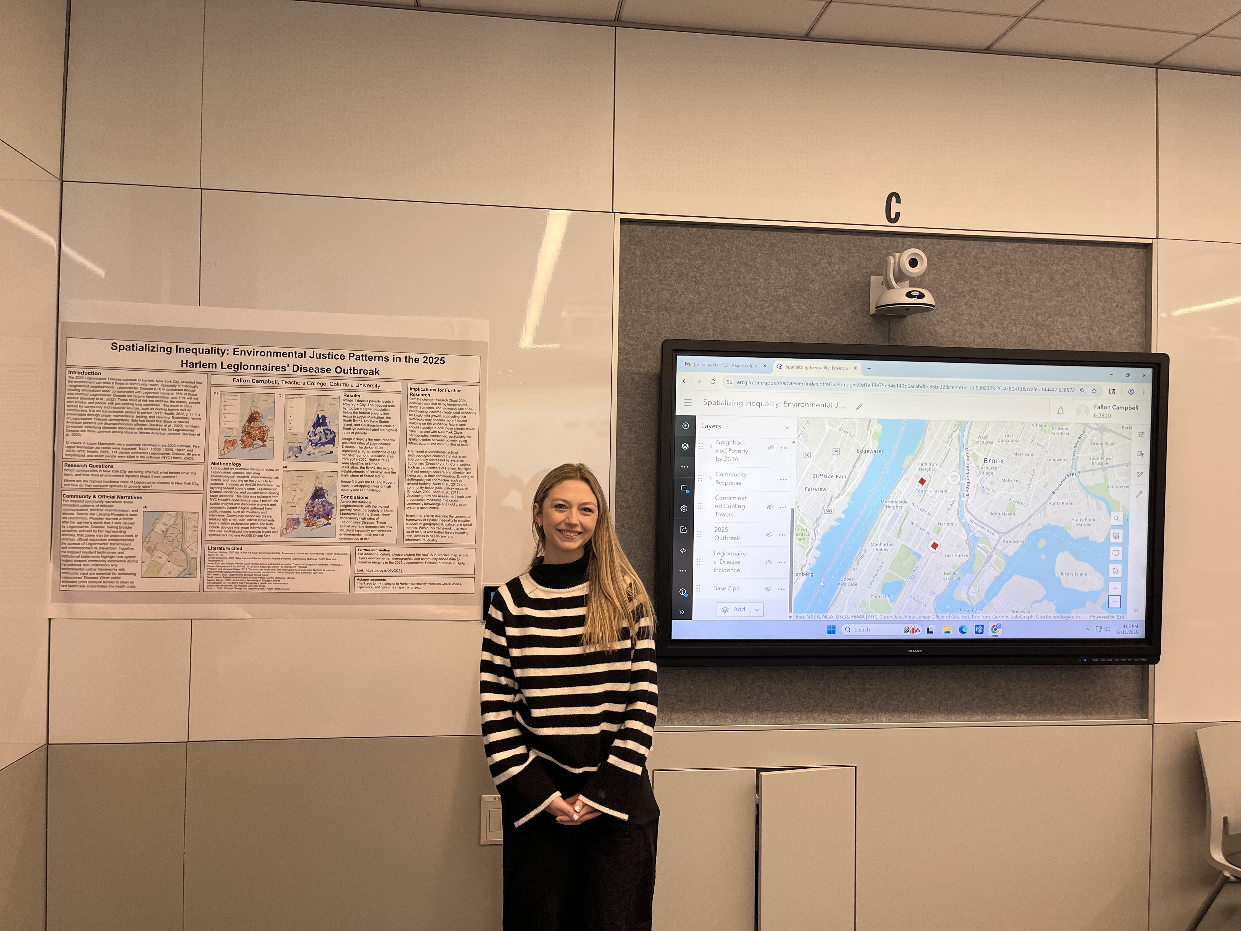 Image of Science Education student Fallon in front of her research display