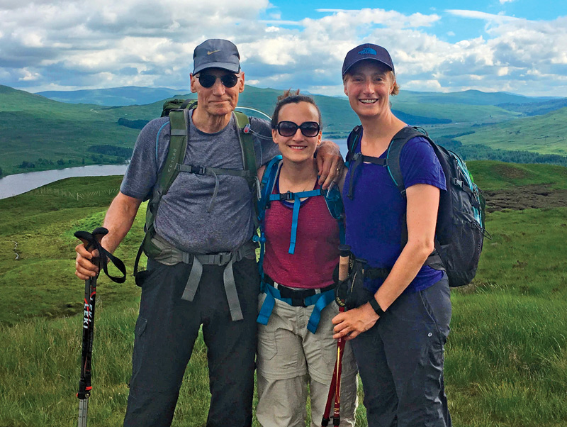 Tom Bailey hiking with his daughters