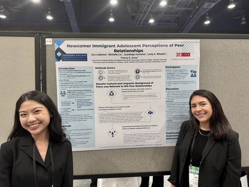 Students Michelle Liu and Ana Ledesma in front of their research poster