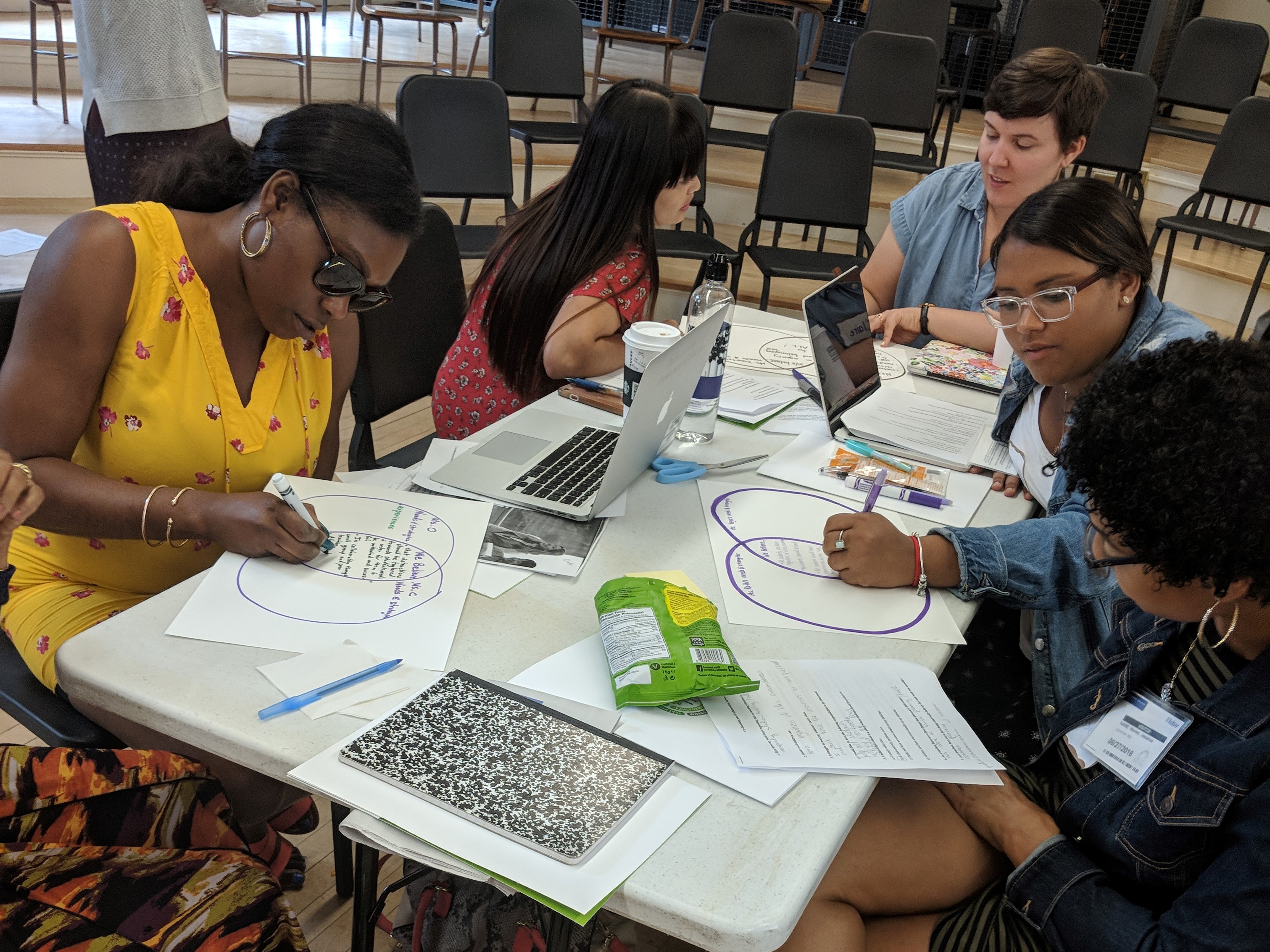 Graduate students work on a project together.