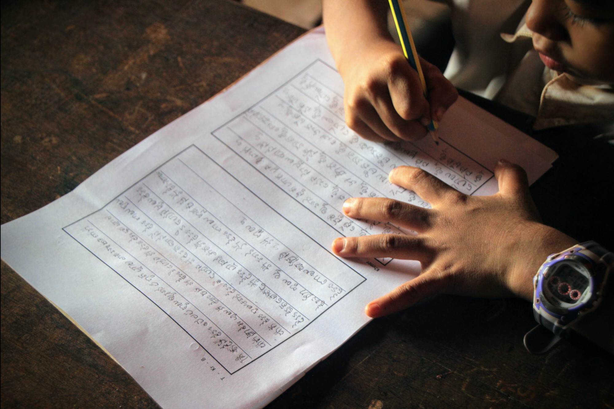 Image of a child writing_from languages and educational development website