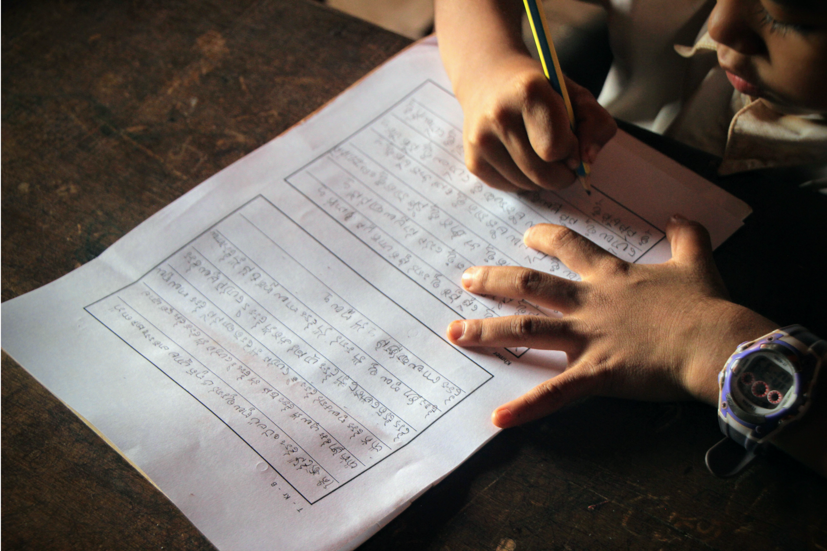 Image of a child writing_from languages and educational development website
