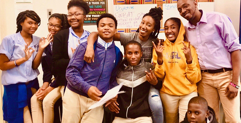 Krystal Hardy Allen (pictured center) surprised her former kindergarten students when she visited their 8th-grade English class at KIPP Believe College Prep in New Orleans in February.