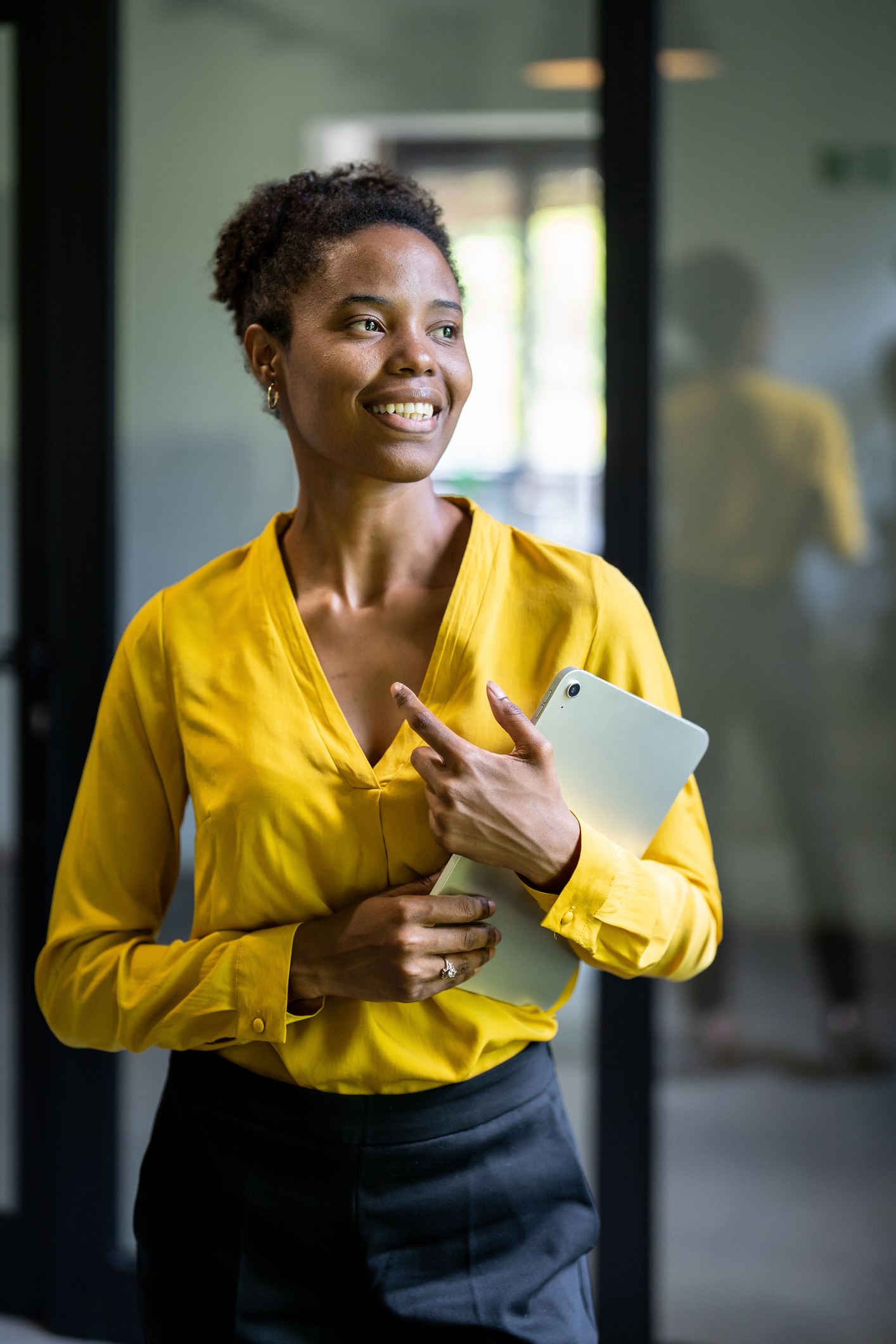 smiling business woman holding clipboard