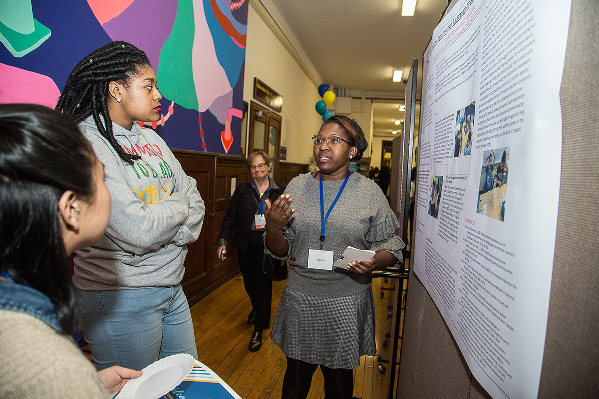 BEST IN SHOW Doctoral student Lisa McDonald (right) won the student research poster competition.