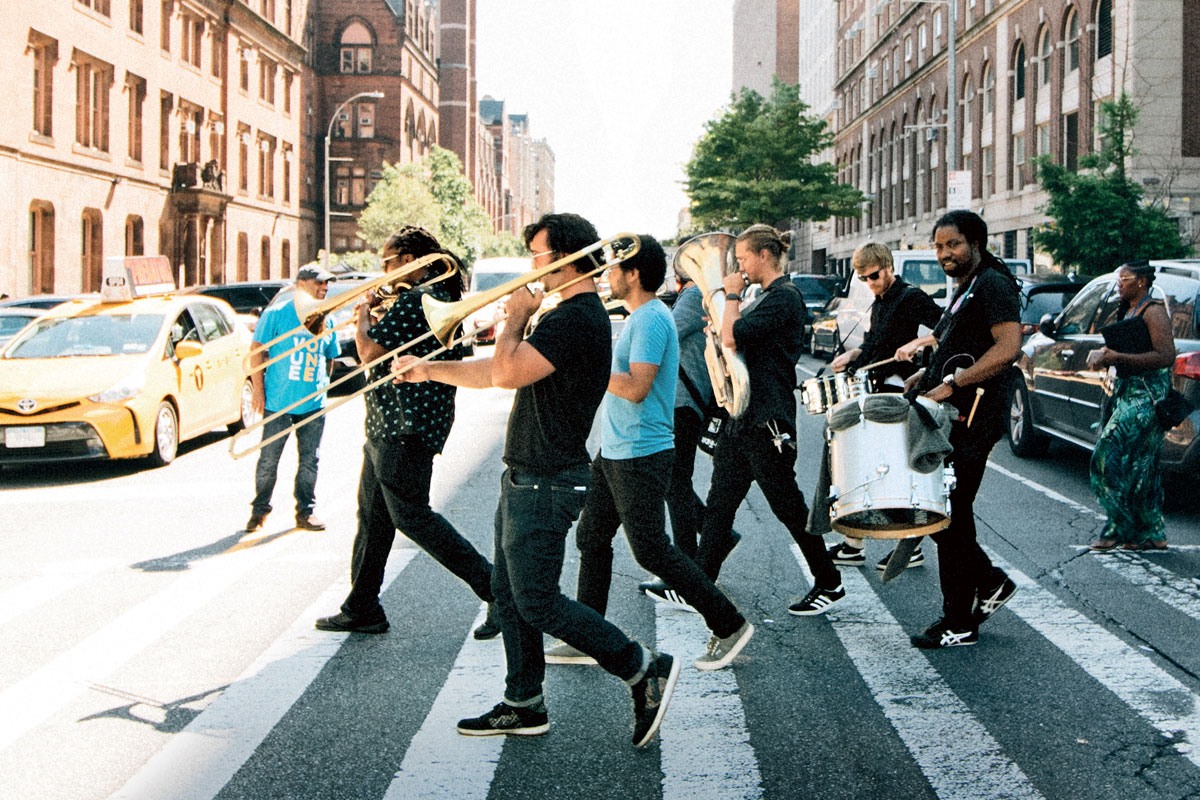 Marching band crosses 120th street during orientation