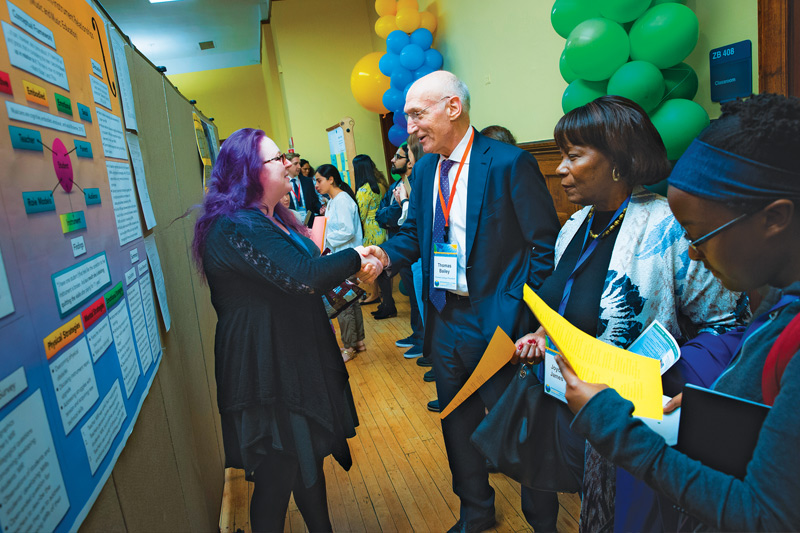 President Thomas Bailey at TC Academic Festival poster session