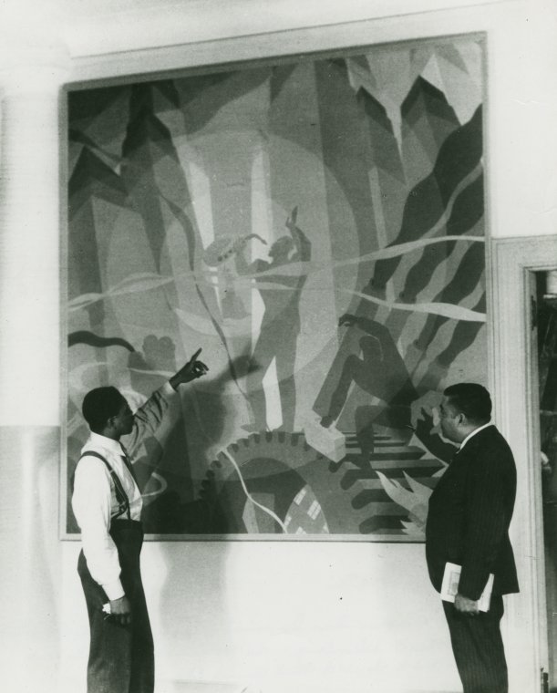 Artist Aaron Douglas (left) and Schomburg Collection curator Arthur A. Schomburg in front of Douglas's painting 