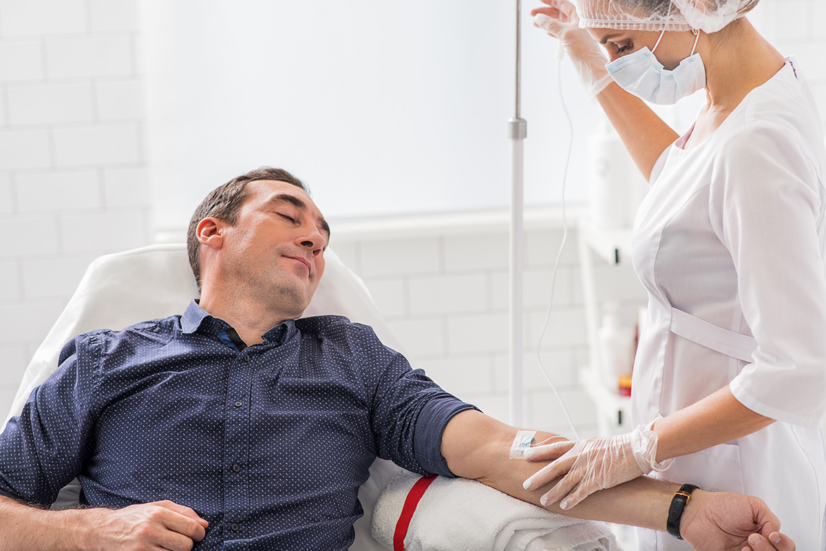 nurse changing a central line dressing