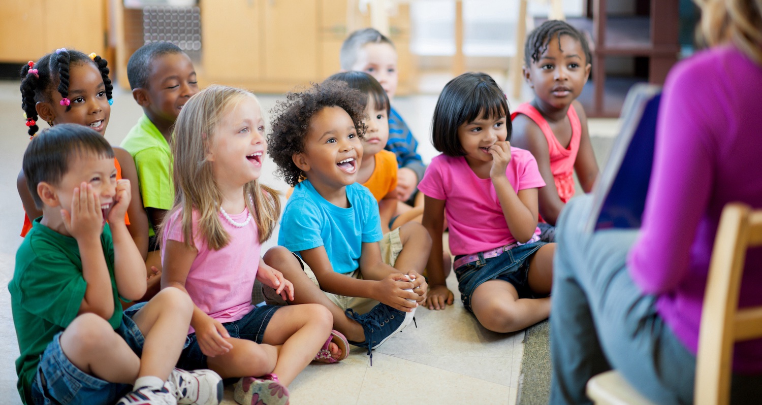 A group of cheerful kids learning in a classroom