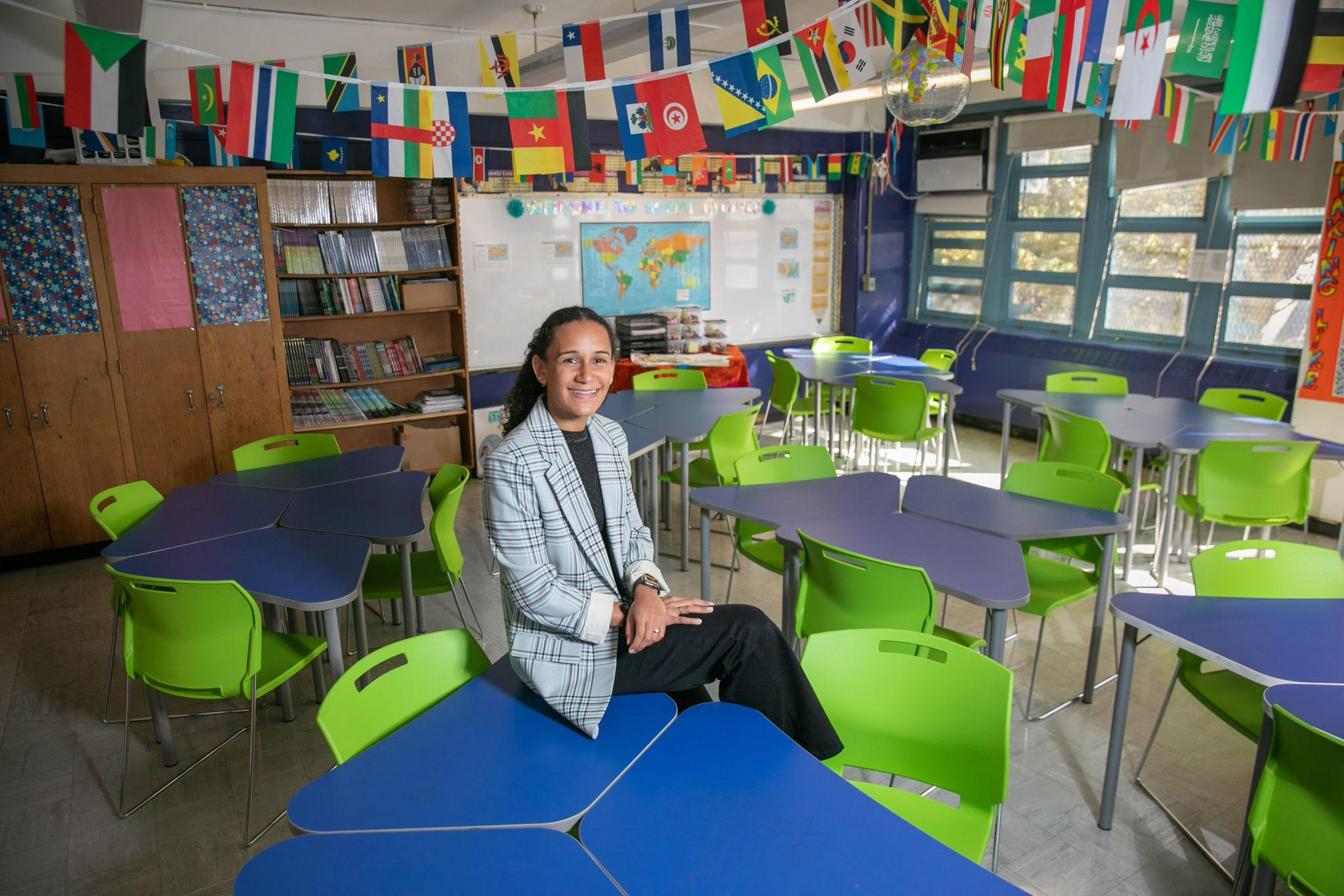 Shani smiling in her middle school classroom