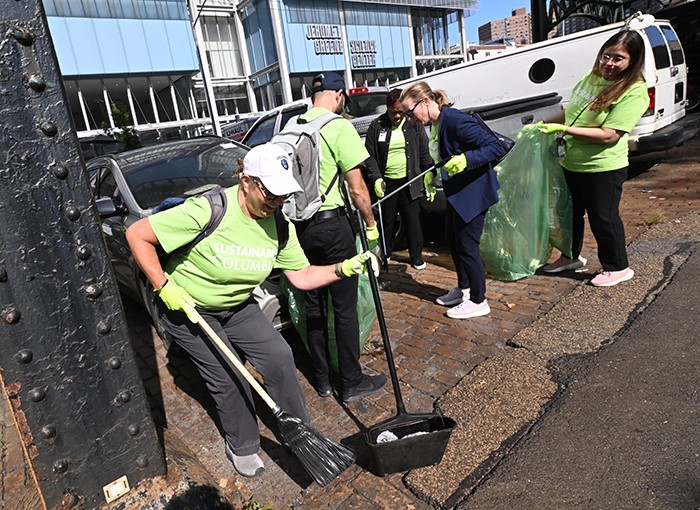 Community members join the Great Broadway Sweep.
