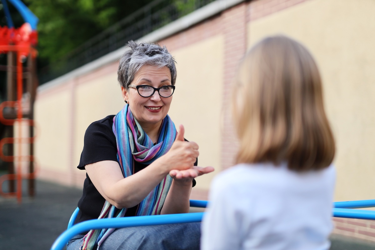 Teacher using American Sign Language with student