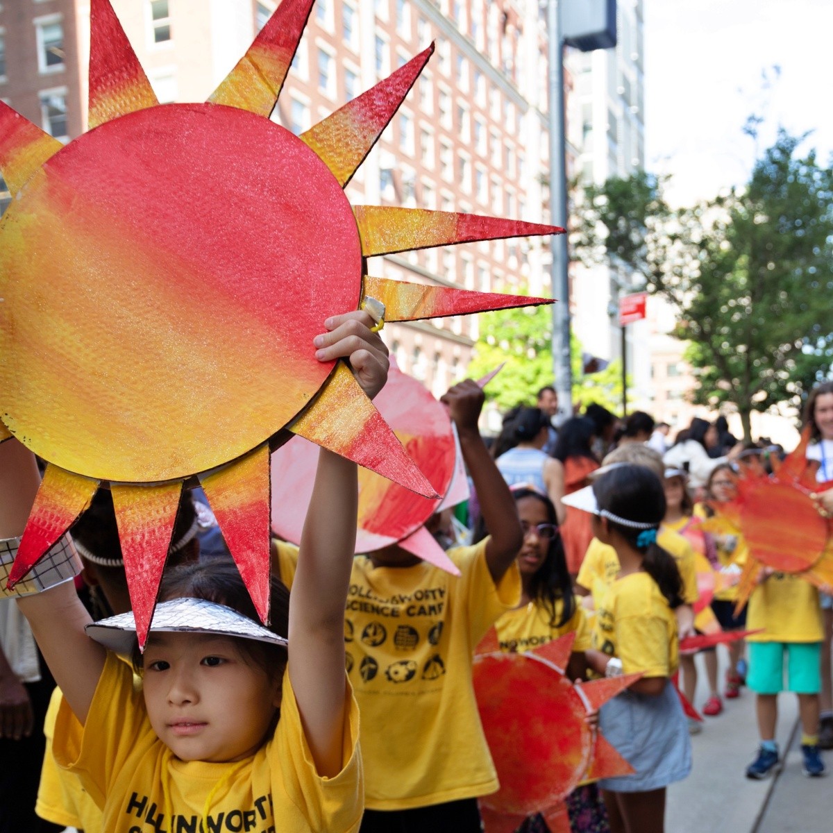 Student with sun craft during parade