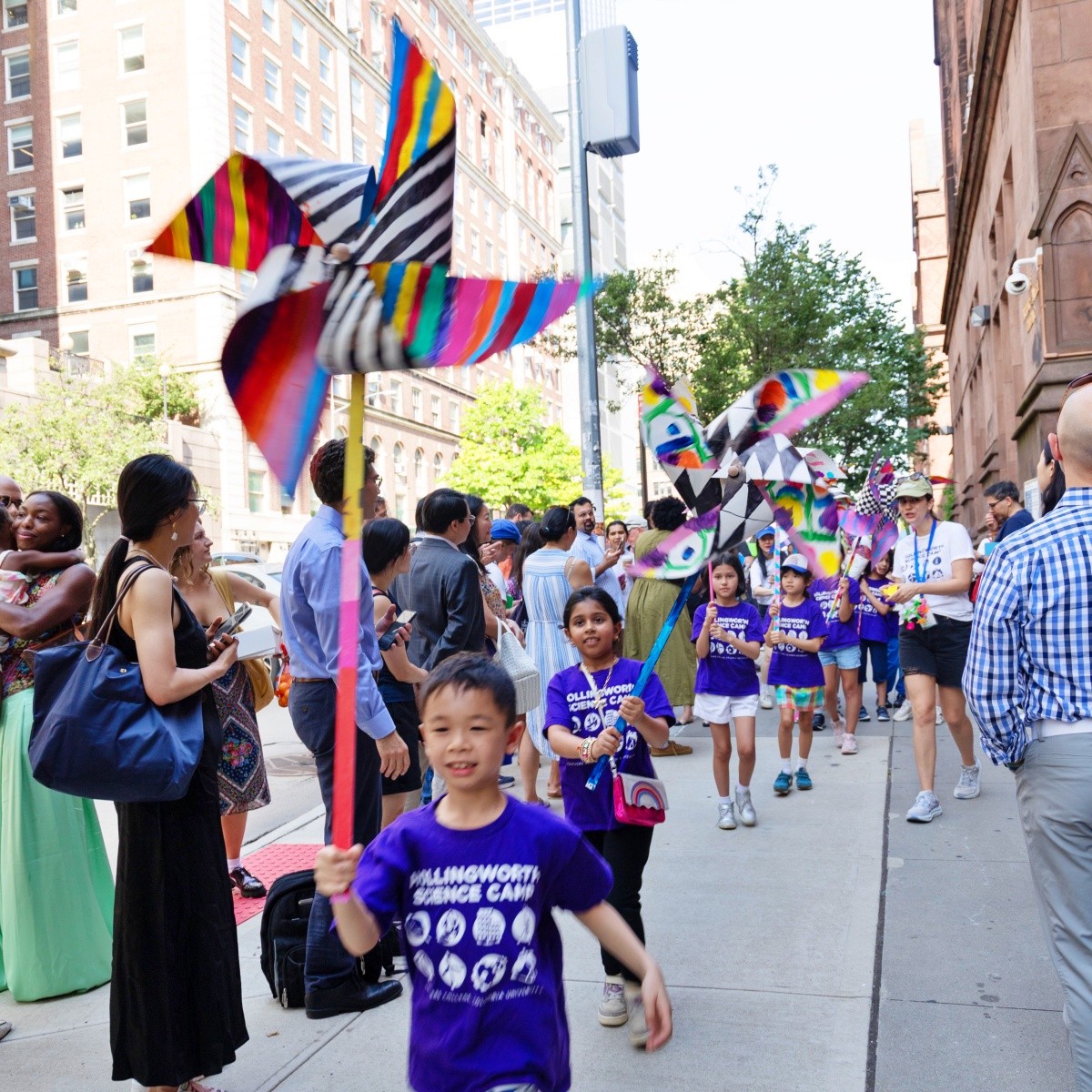 Students with large pinwheels during the parade