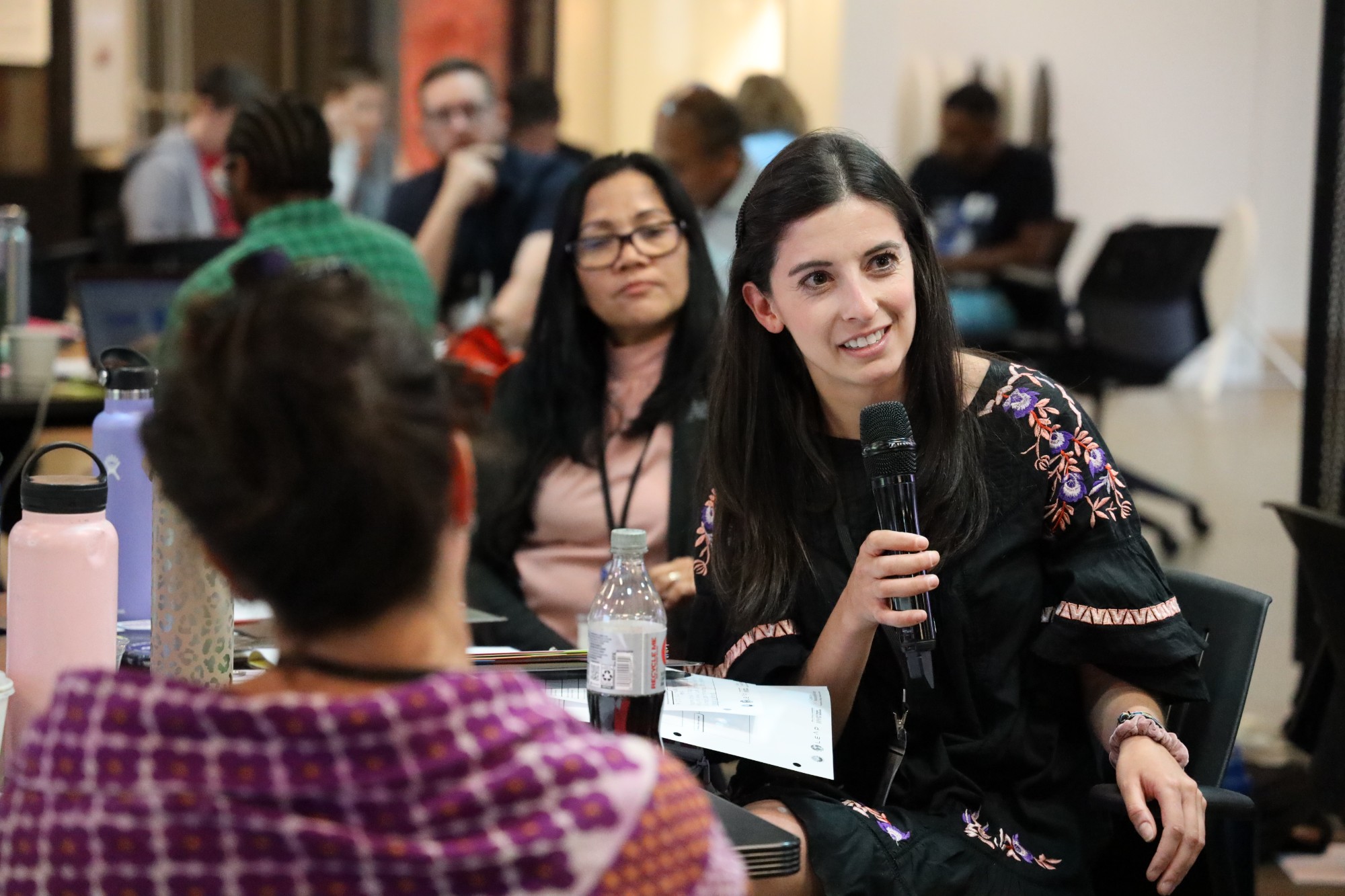 Participants ask questions during the interactive Summer Climate Institute