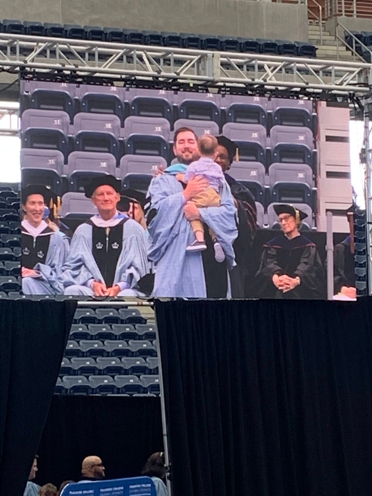 Pictured: Doctoral hooding.