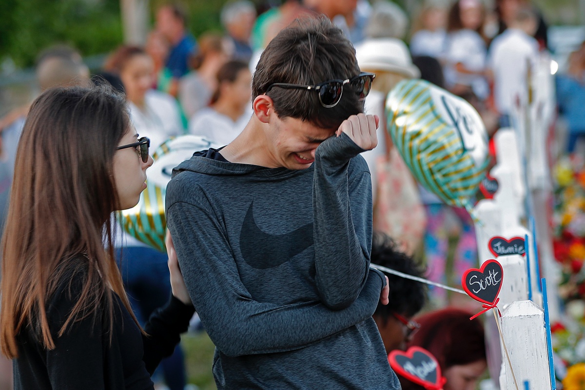 Boy crying at vigil