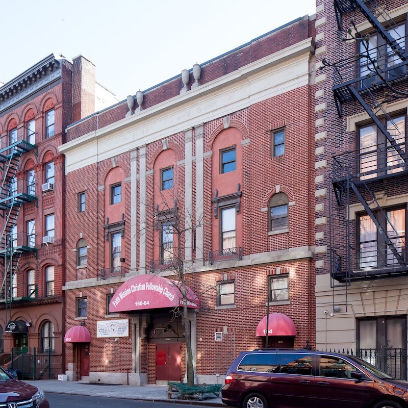 Exterior of athree story brick building