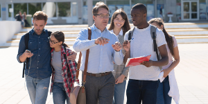 Faculty and students walking and talking