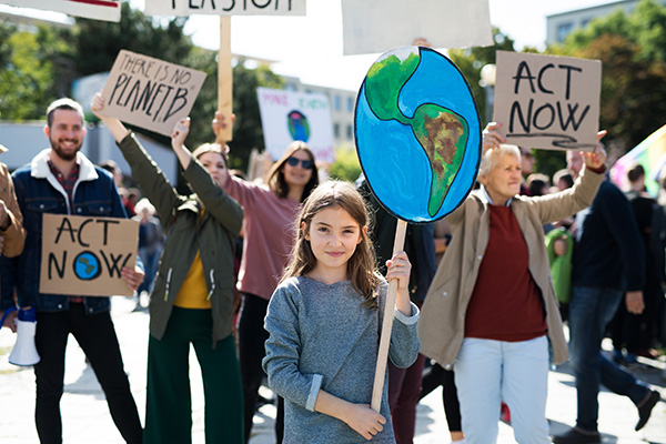 Adults and children at a climate change rally 