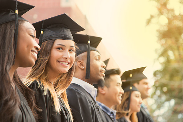 A female college student smiling during her graduation